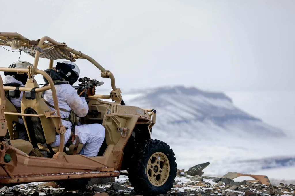 soldiers in off road vehicle