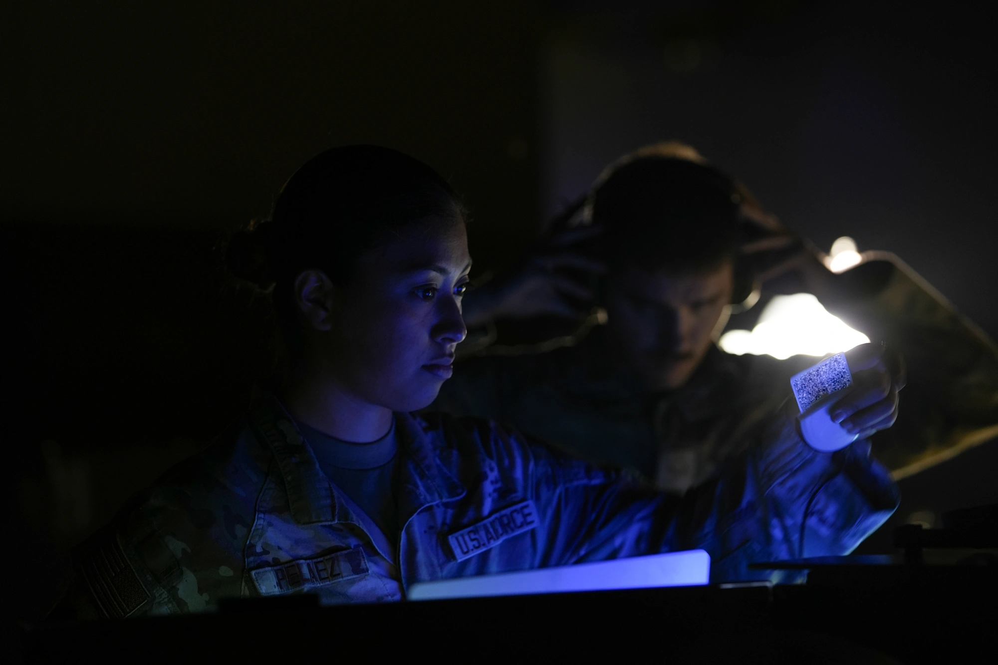 soldiers looking at screens
