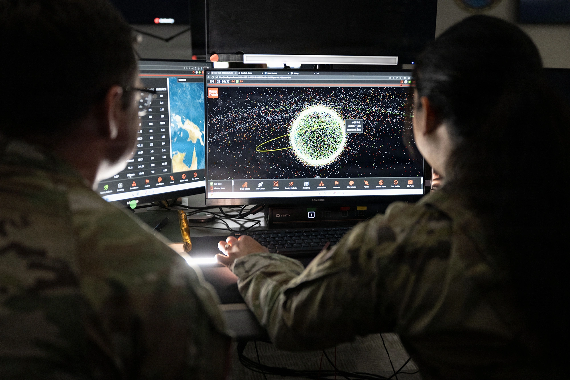 soldiers looking at defense imagery on screen